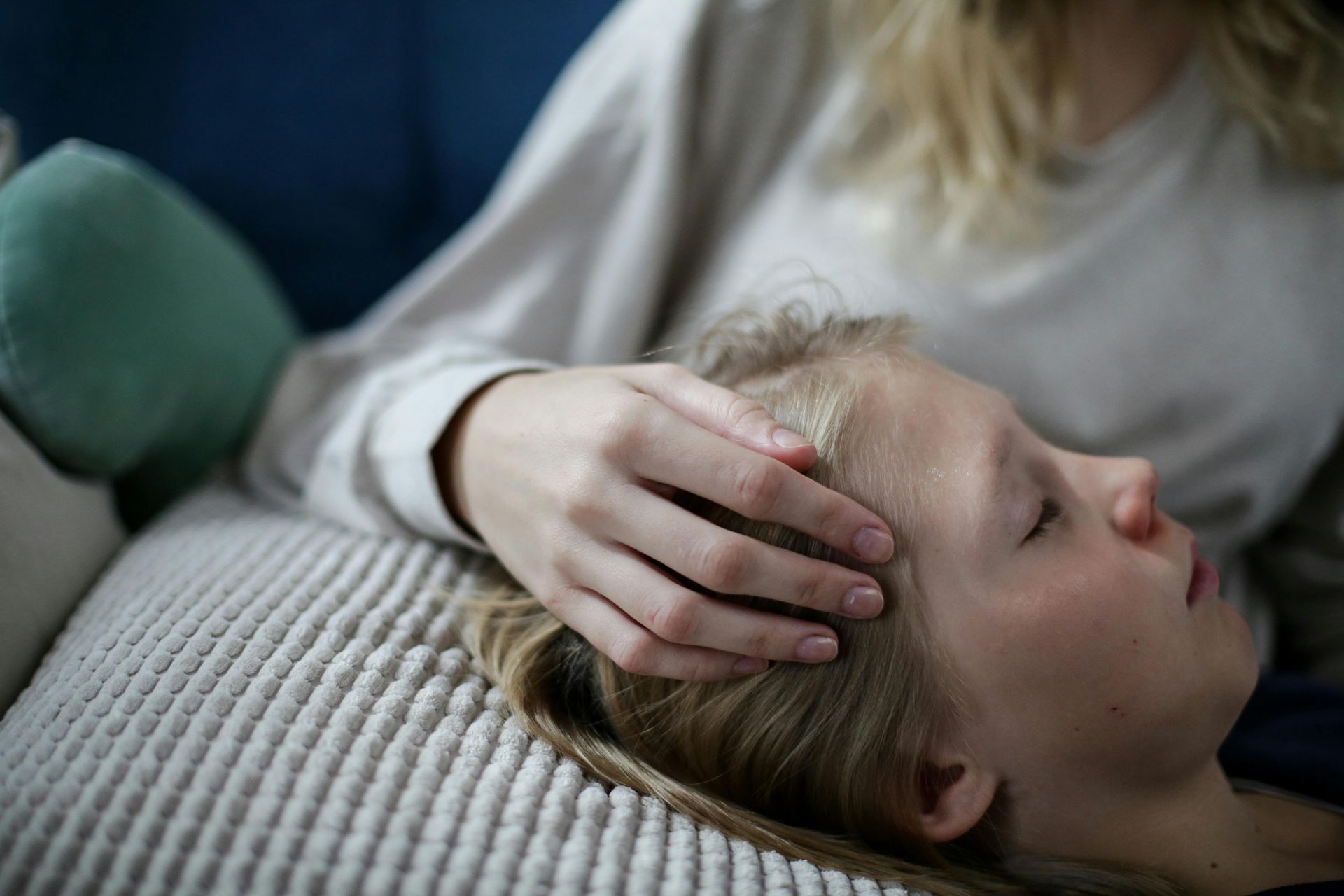 Sick Child in the arms of the mother