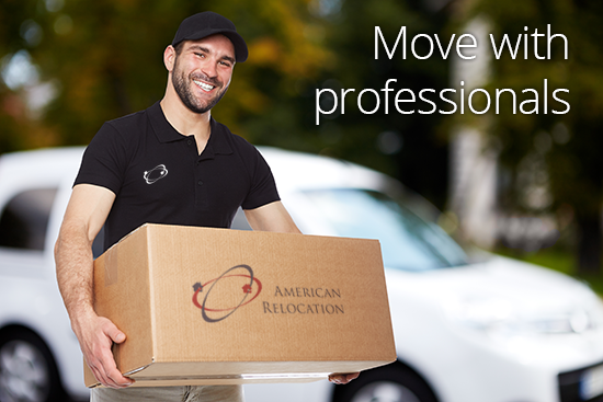 Smiling man in black uniform holding a box, with a white van in the background; text