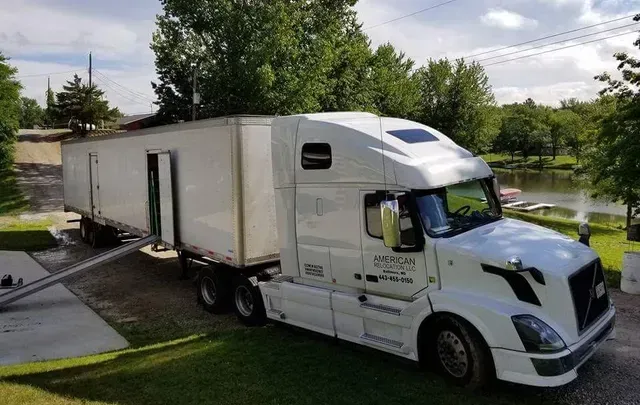 American Relocation moving truck positioned at a residential property during a relocation project