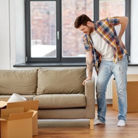 a person hurt his back after moving boxes