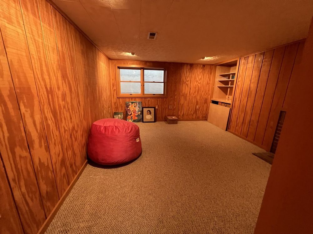 There is a bean bag chair in the middle of the room.