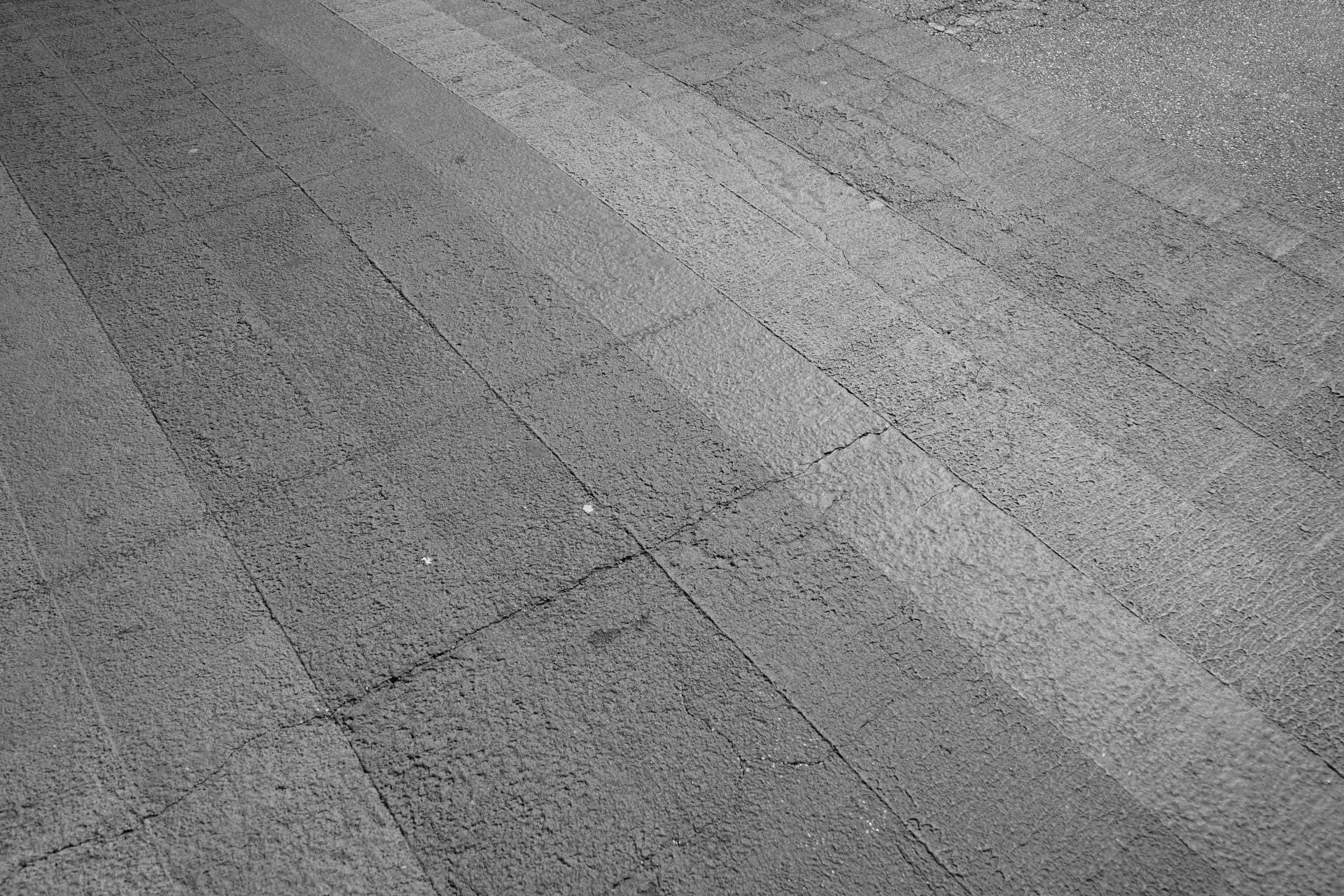Gray tiled pavement with diagonal seams and subtle texture