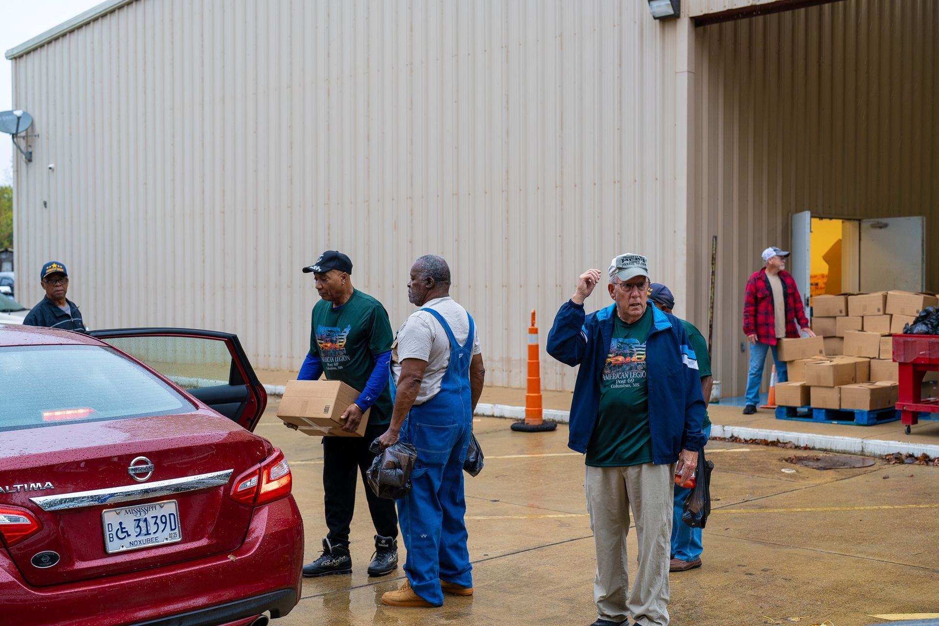 American Legion Post 69 members giving away food