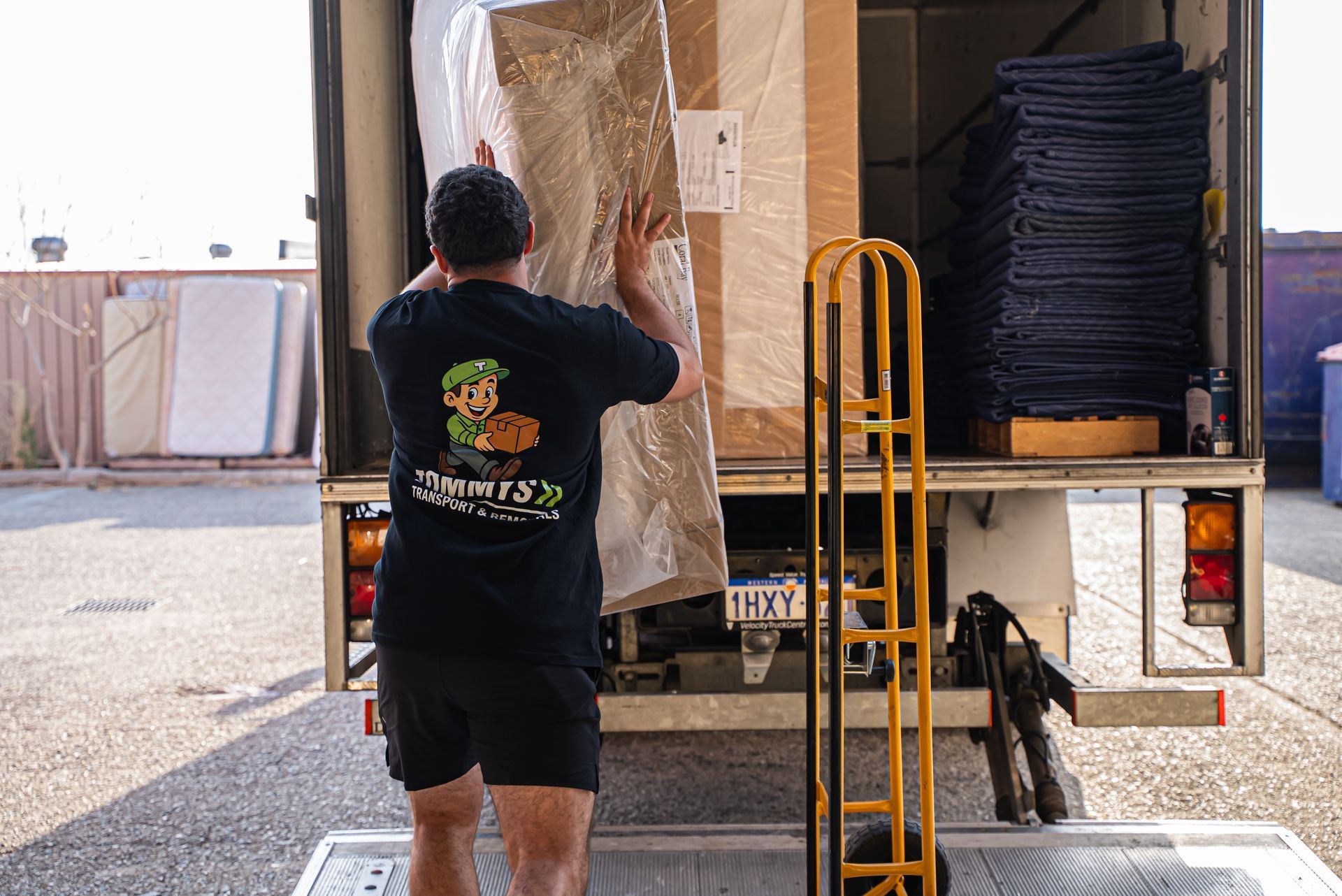 Removalist team unloading removalist truck