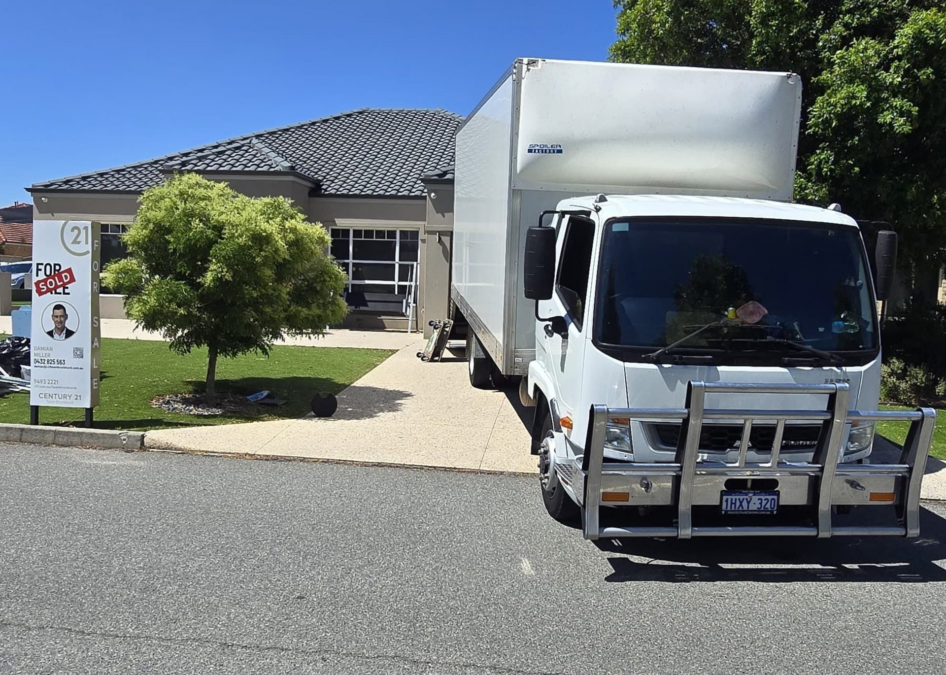 Removalist truck out front if recently sold house in Perth.