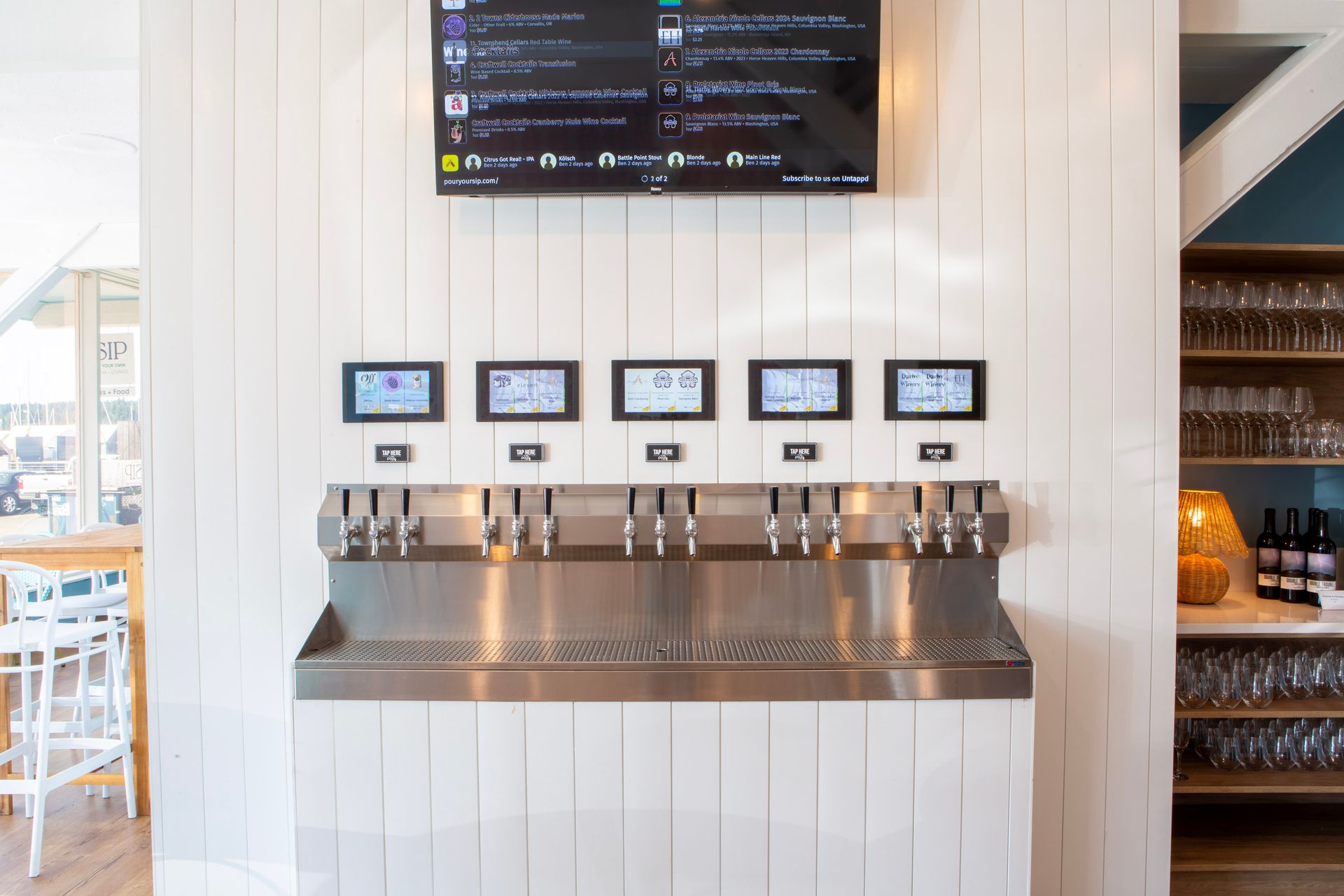 Our wine lounge tap wall at The Sip. 15 rotating wine and cocktail taps.