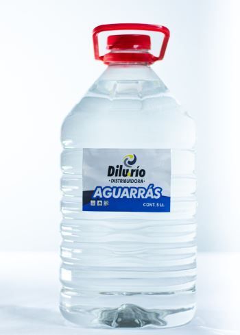 Botella de aguarrás marca “Diluvio” con tapón rojo.