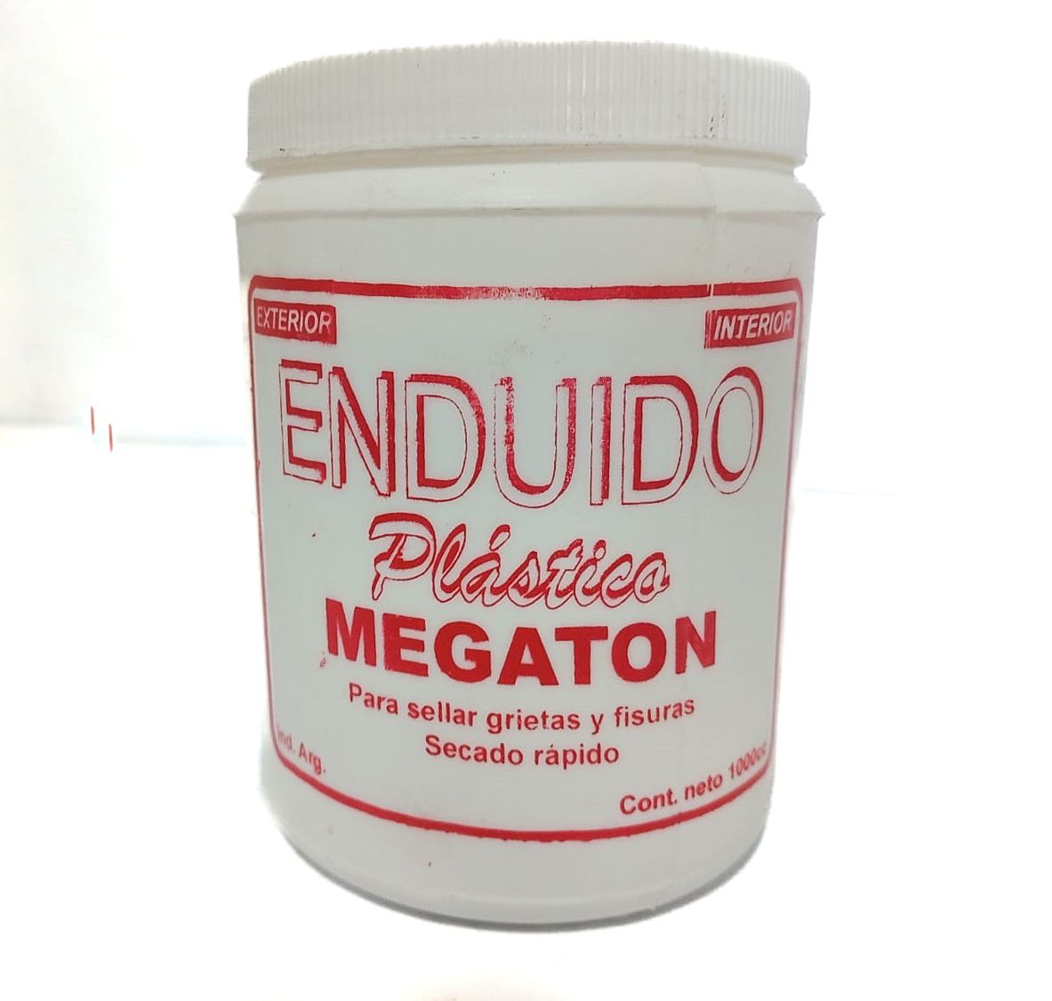 Envase de plástico blanco de yeso “ENDUIDO”, marca “MEGATON”, para sellado de grietas y fisuras.