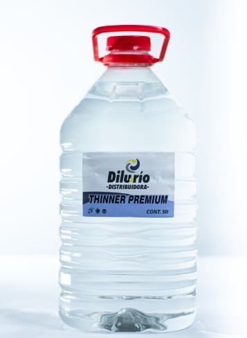Botella de Dilurio Premium Thinner con tapón rojo y etiqueta blanca.