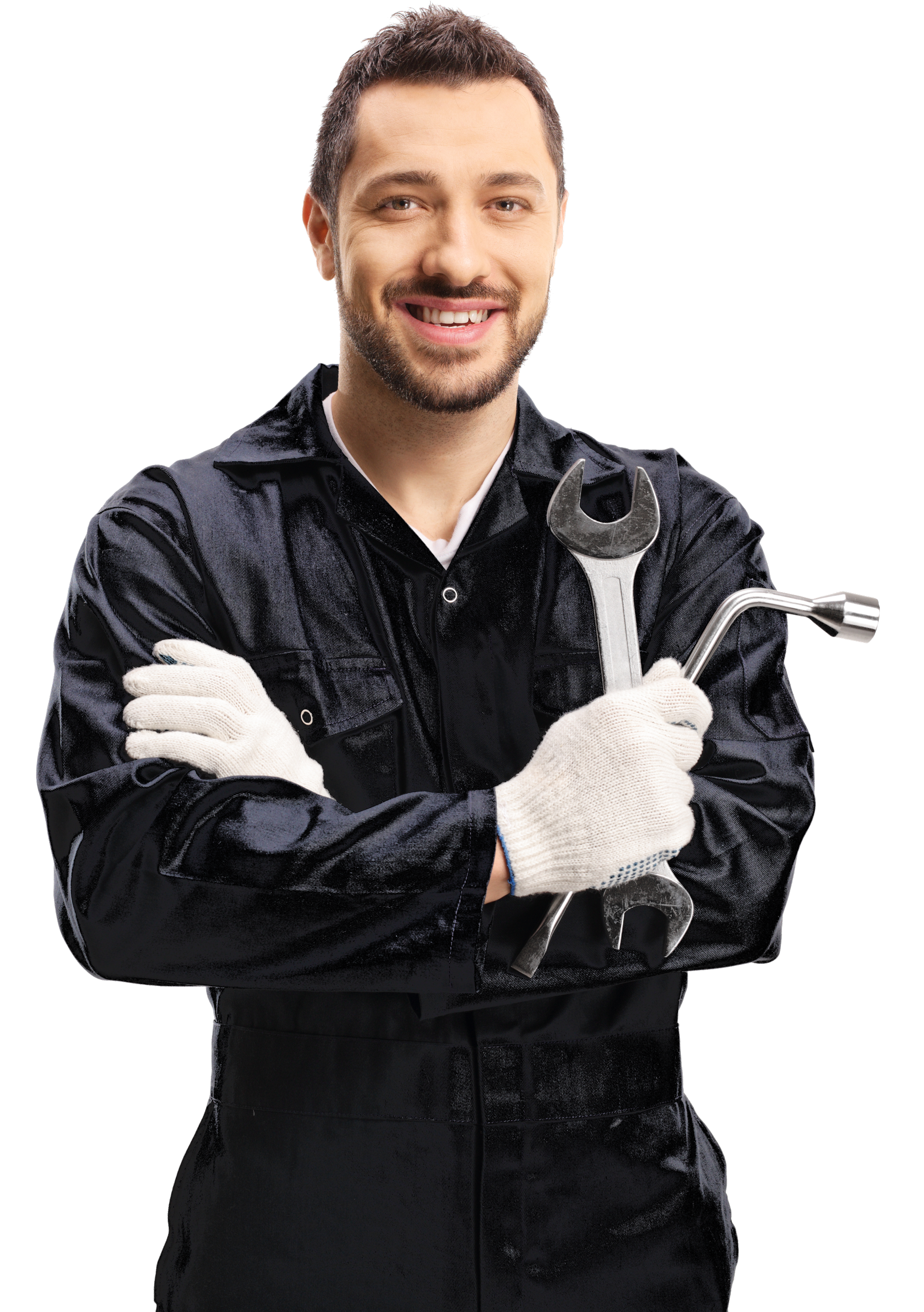 A man in a black jumpsuit is holding a wrench and smiling.