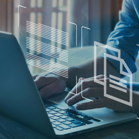 Image of a person working on a laptop