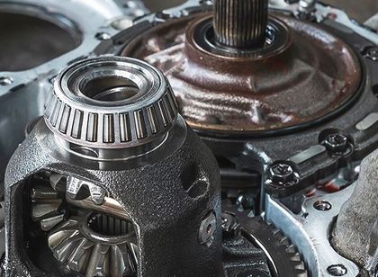 Close-up of mechanical gears and a bearing inside a metal machine assembly