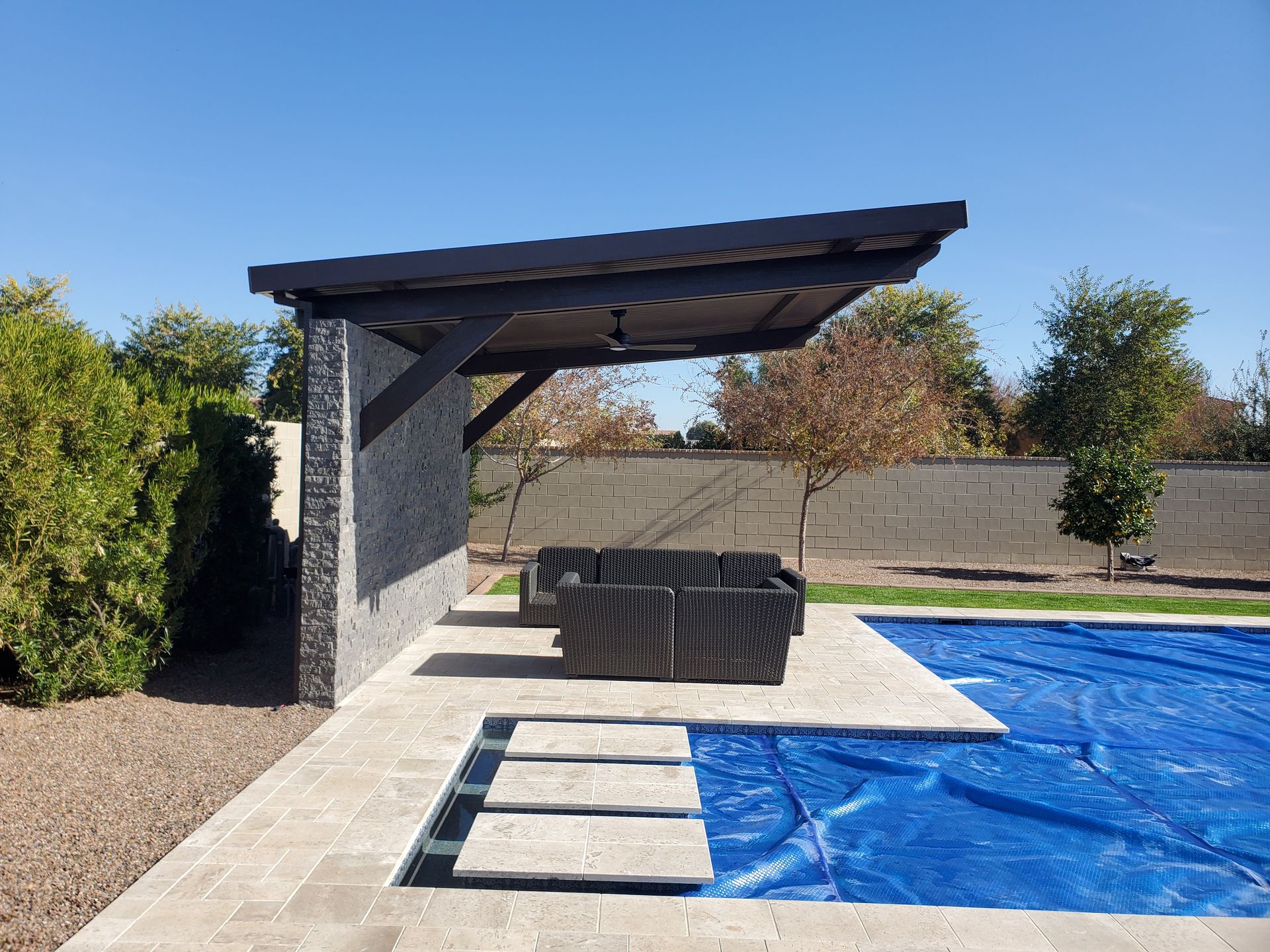 Contemporary cantilever patio cover in Surprise, AZ, offering a sophisticated touch to backyard designs.