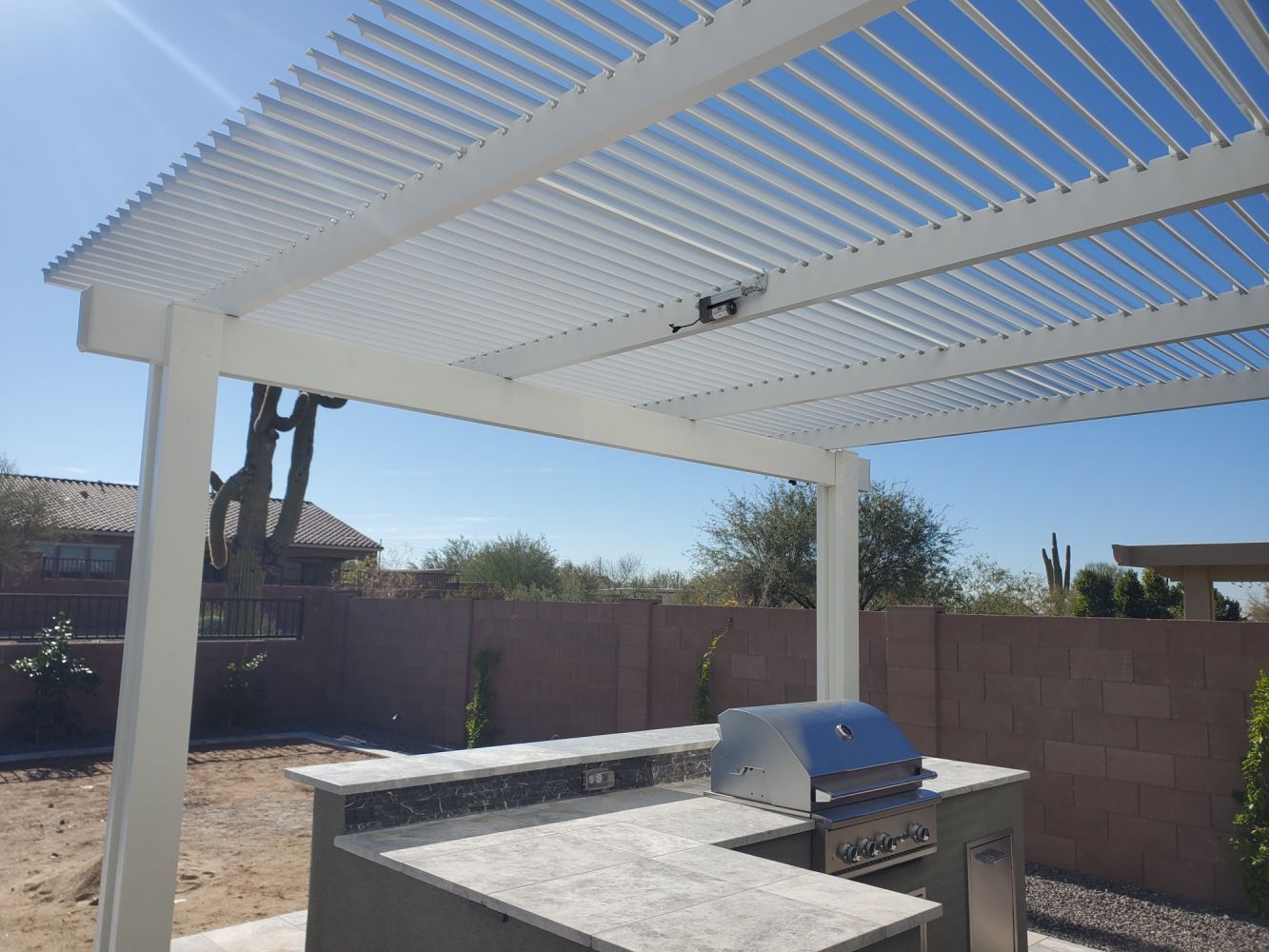 Sophisticated adjustable louvered cover installed in Scottsdale, enhancing patio usability throughout the year.