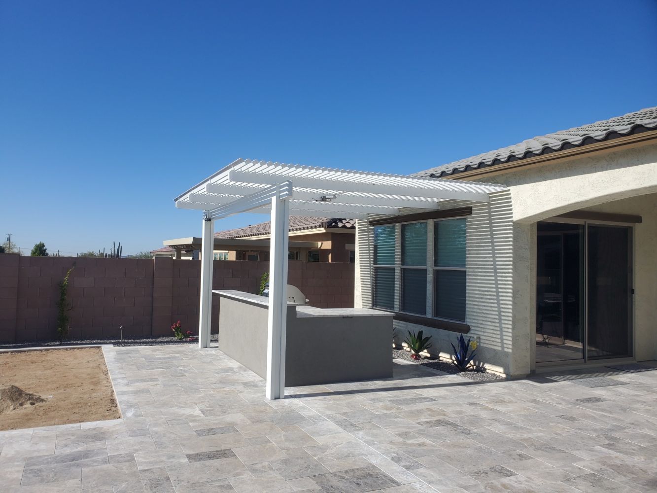 State-of-the-art louvered patio cover by Southwest Patio, allowing precise light control in Tempe's sunny climate.