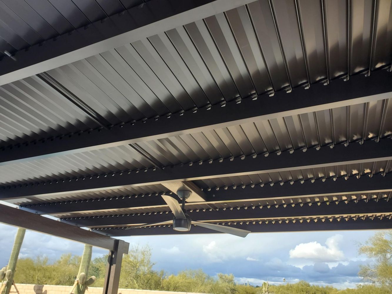 Innovative adjustable louvered patio cover by Southwest Patio, providing customizable shade in Phoenix, AZ.