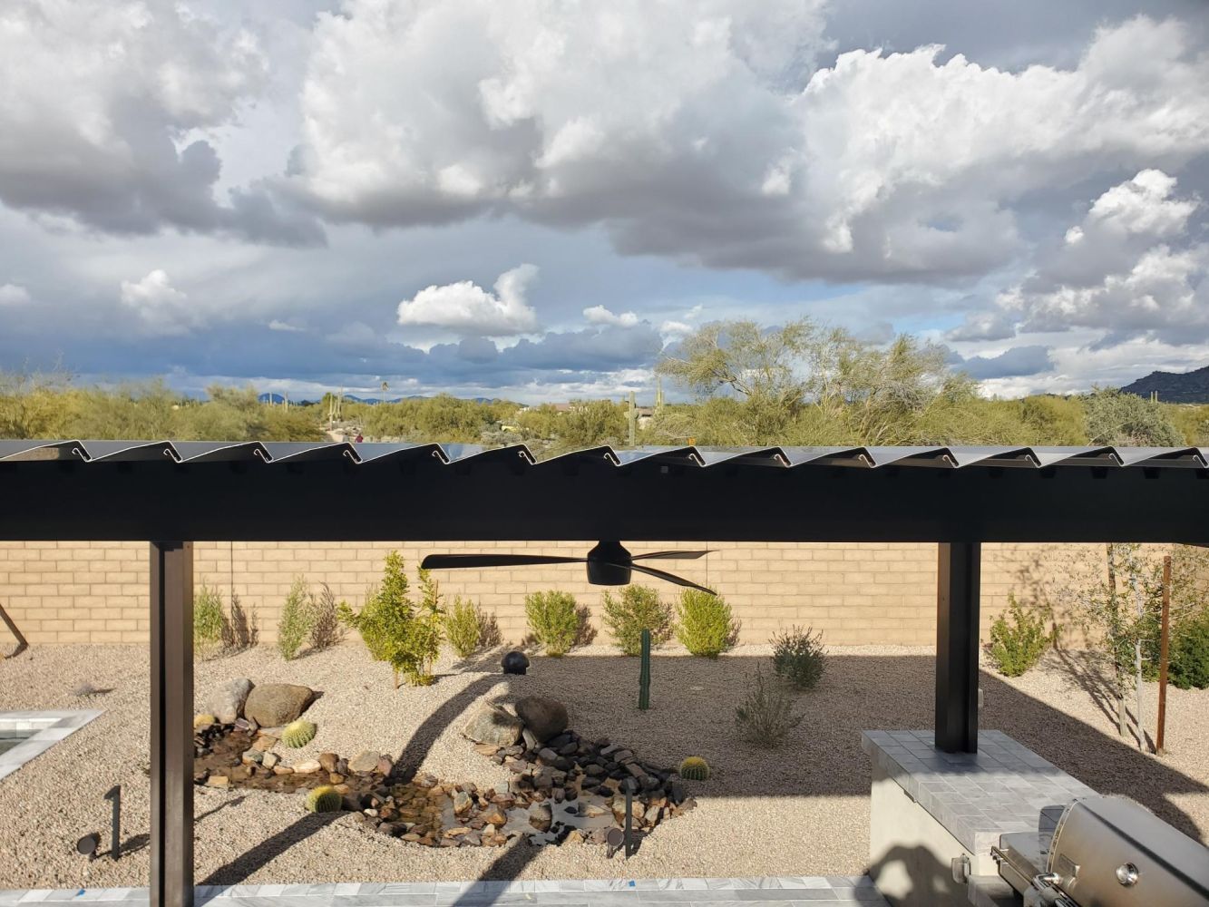 Louvered roof installation by Southwest Patio, adding modern flair to Cave Creek homes.