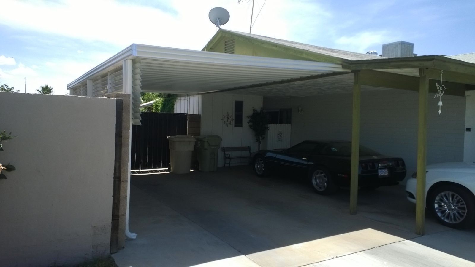 Innovative 'W' Style Pan Cover providing efficient shade and shelter for cars in a Scottsdale residence.