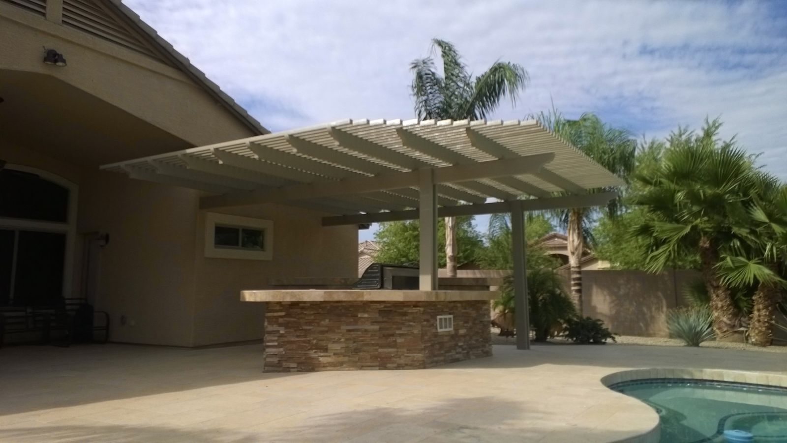 Airy and inviting lattice patio cover design by Southwest Patio, perfect for Scottsdale's sunny climate.
