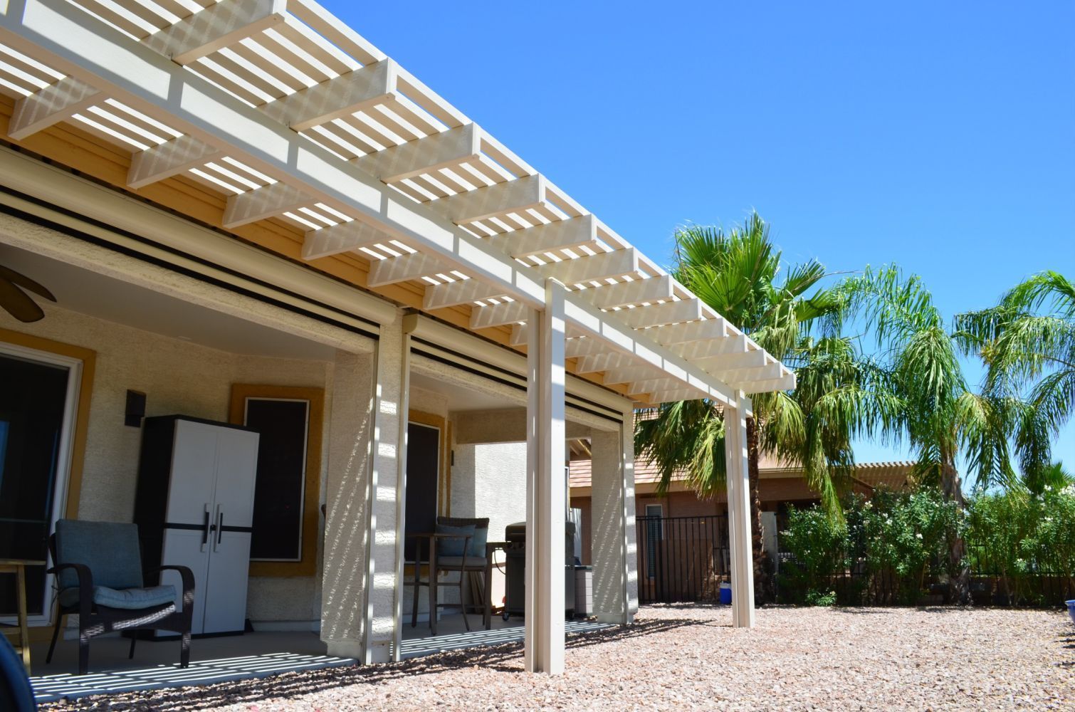 Sophisticated open-style lattice patio cover, enhancing outdoor living with elegance in Mesa, AZ.