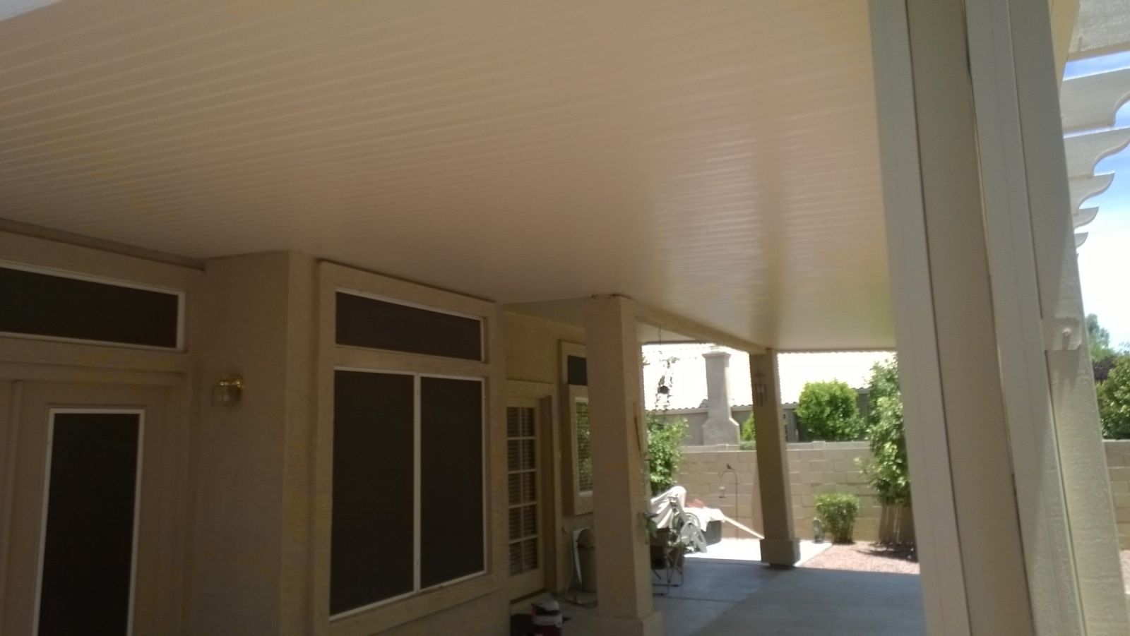 Goodyear homes boast energy-efficient Flat Pan Patio Covers, reducing cooling costs with stylish shade.