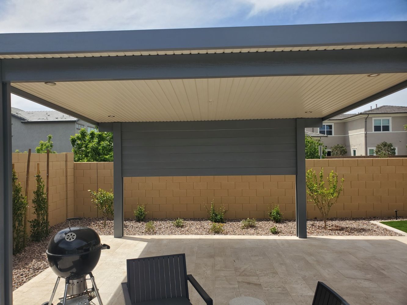 Gilbert residence featuring a robust Flat Pan Patio Cover, providing ample sun protection and style.