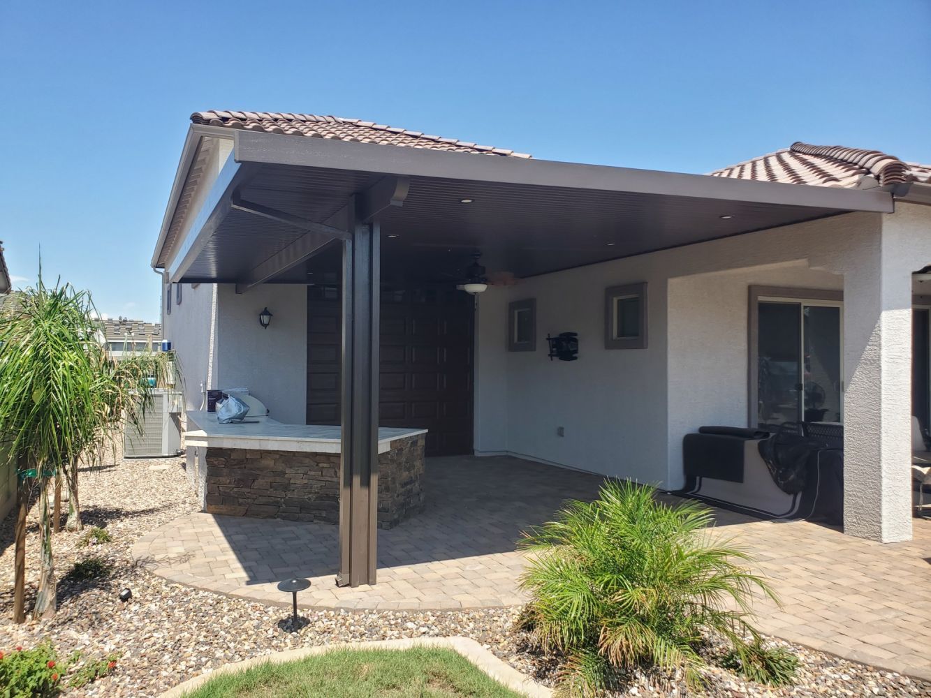 Beautiful Mesa home enhanced with a custom patio cover by Southwest Patio, blending seamlessly with Arizona's landscape.