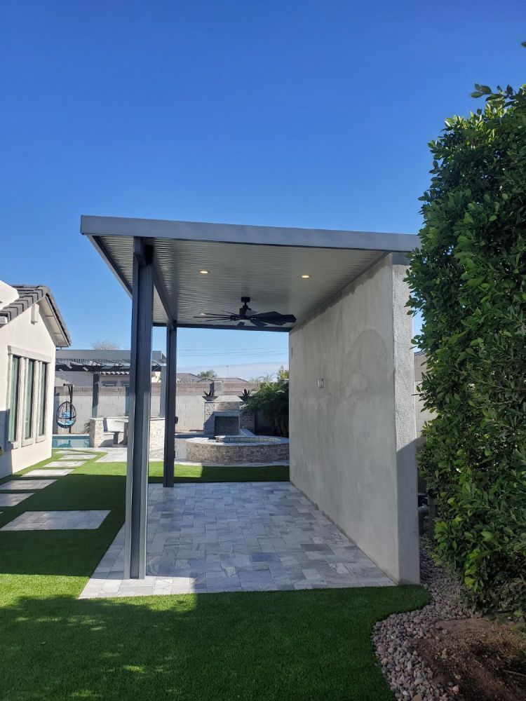 Stylish Solid Flat Pan Patio Cover providing ample shade in a Phoenix backyard.