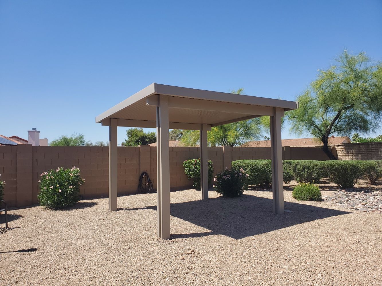 Sun Lakes residences embrace outdoor dining under elegant Flat Pan Patio Covers.
