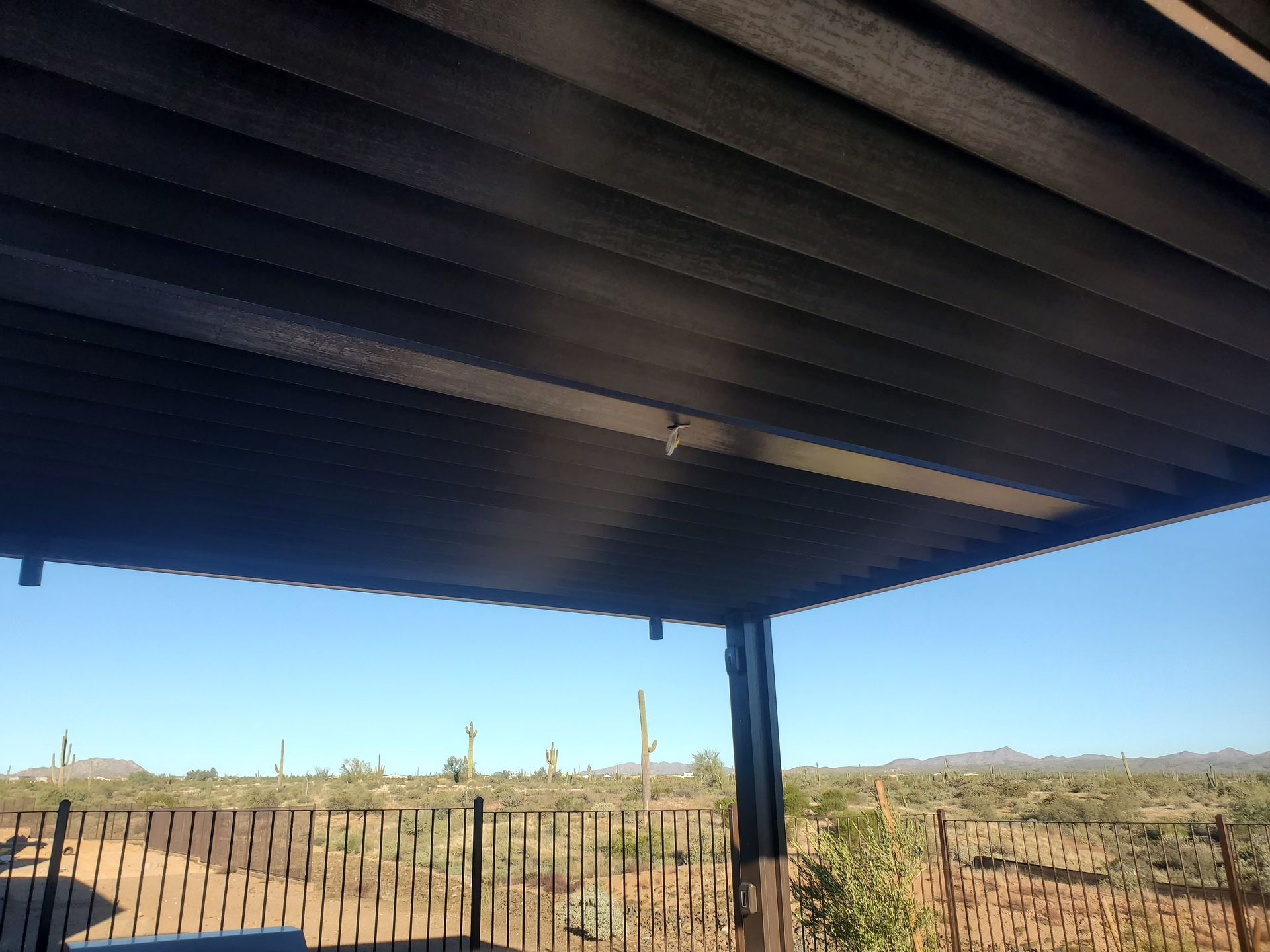 Sleek and modern louvered patio cover design, providing aesthetic appeal and functionality in Gilbert, AZ.