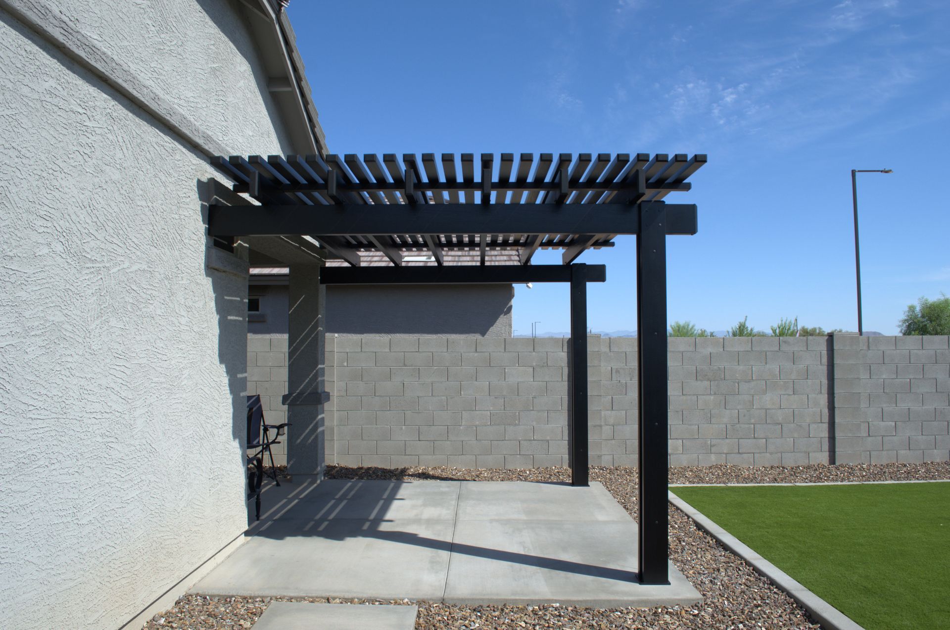 Custom patio shades designed for a residential sunroom in Chandler.