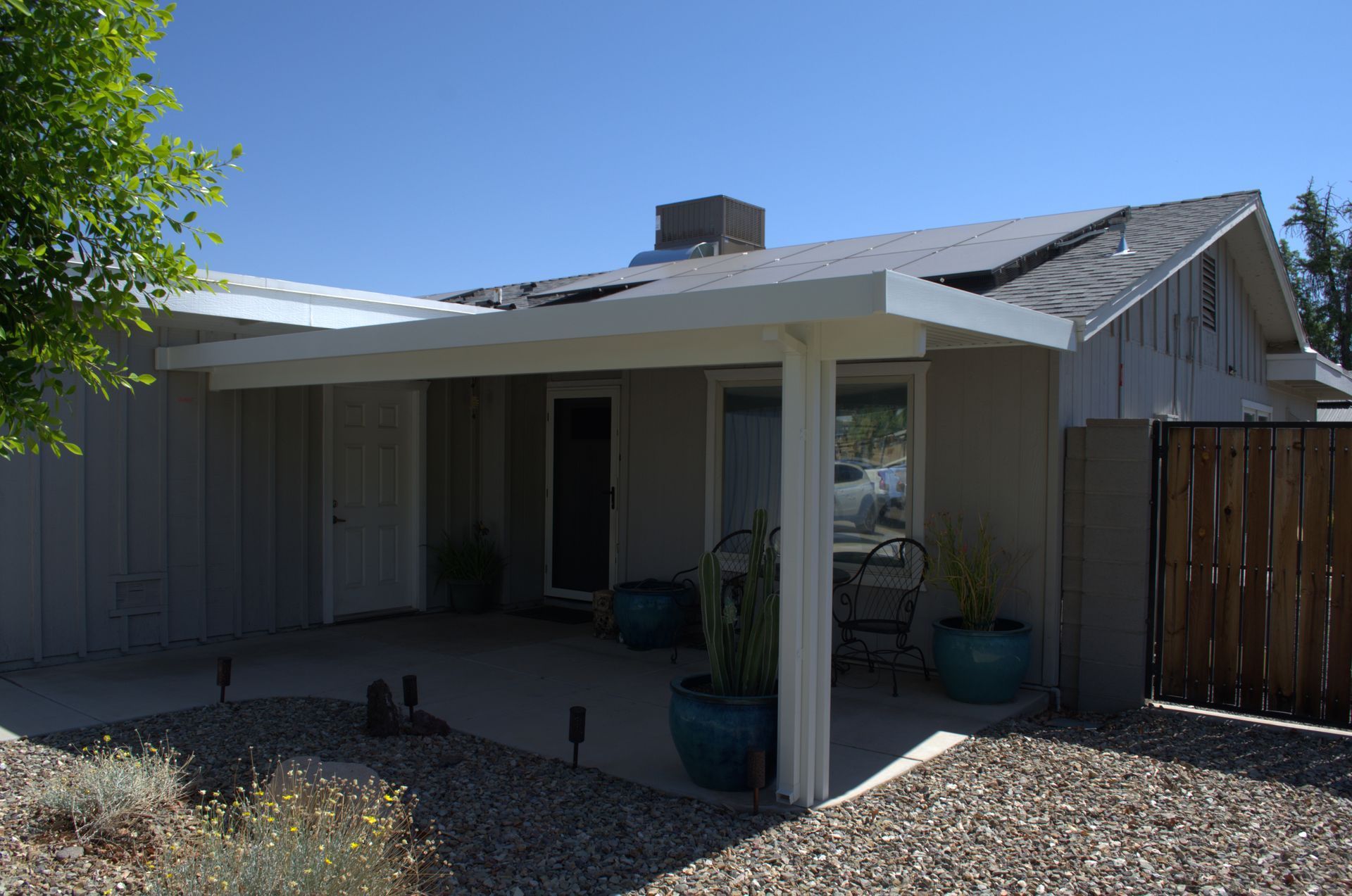 Southwest style awning adding character to a Youngtown back yard patio.