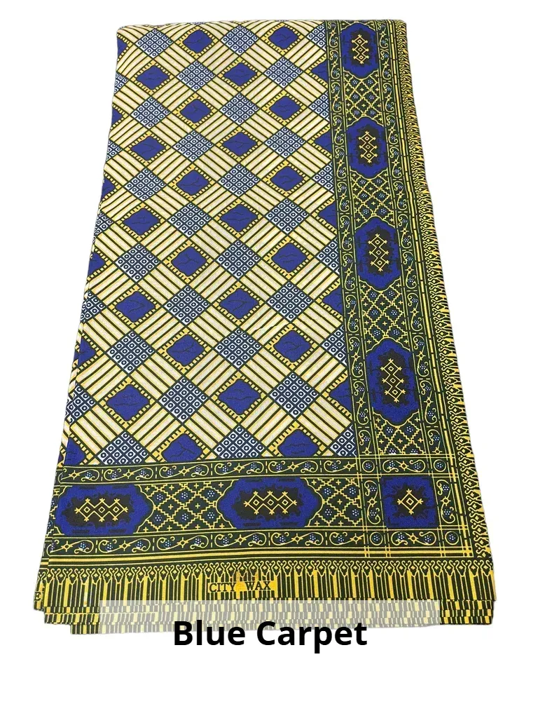 Blue patterned carpet with yellow and green geometric border and fringe
