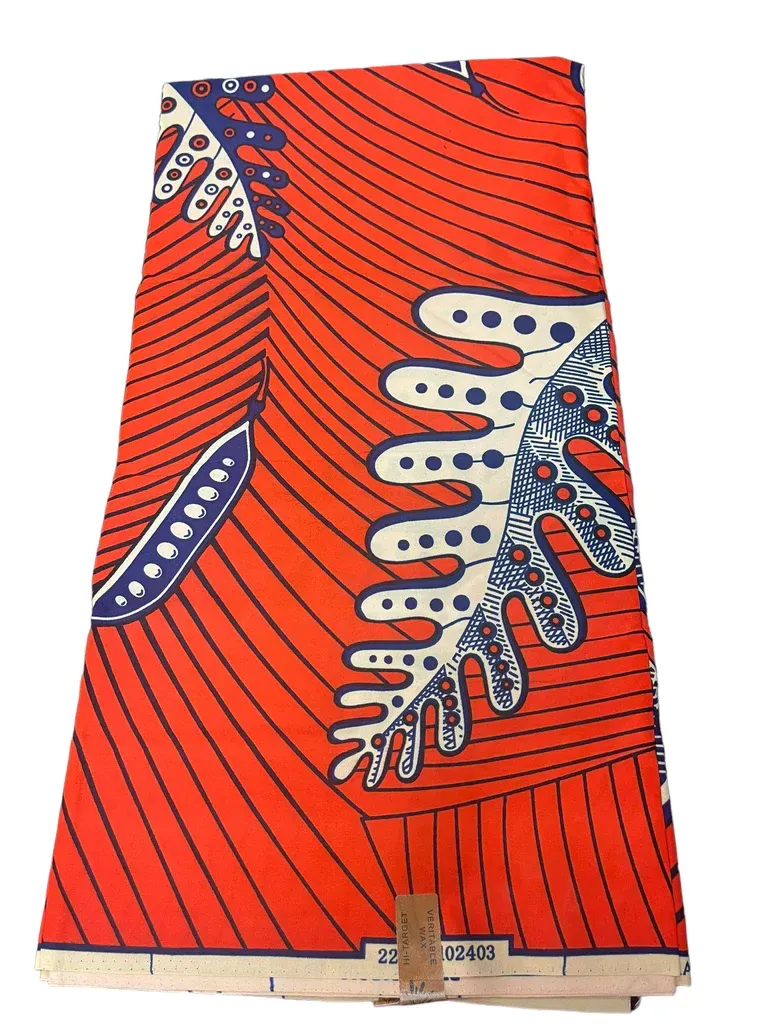 Red patterned fabric garment with white and blue leaf motifs