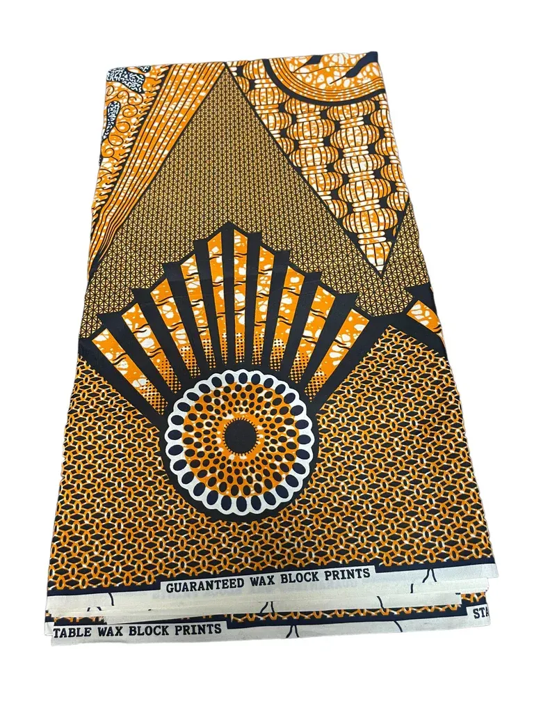 Orange and black patterned fabric with sunburst and floral motifs