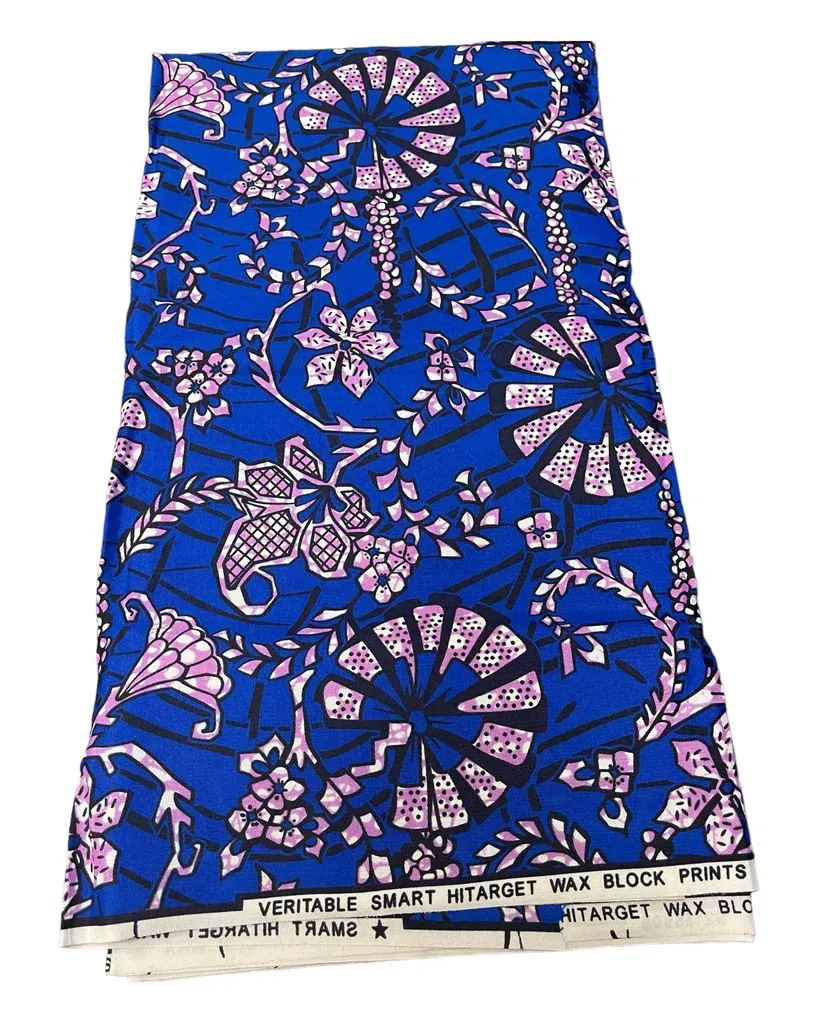 Blue fabric with pink floral and leaf print, folded vertically on a white background.
