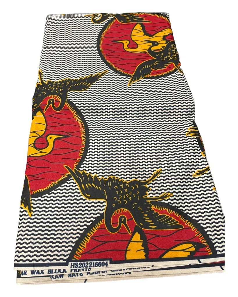White skirt with black zigzag stripes and large red-yellow floral patterns.