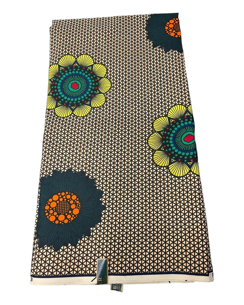 Patterned fabric with beige, black, green, yellow, and orange circular motifs at the bottom of a display stand