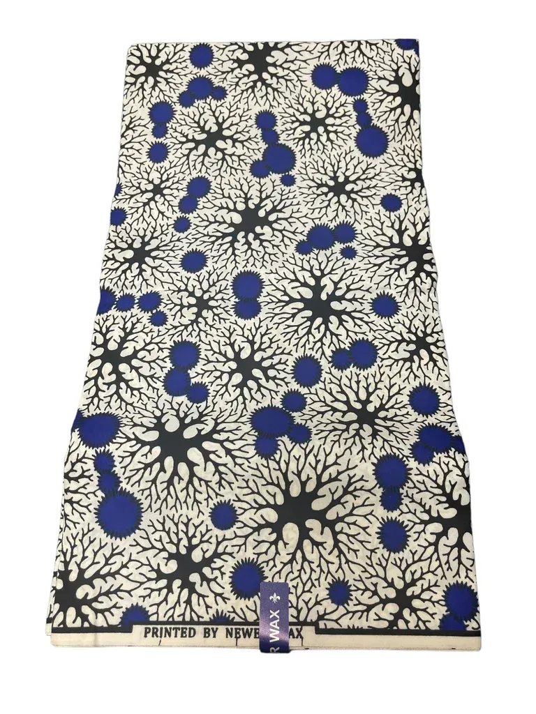 Blue floral patterned dress with cream background and black branch-like design