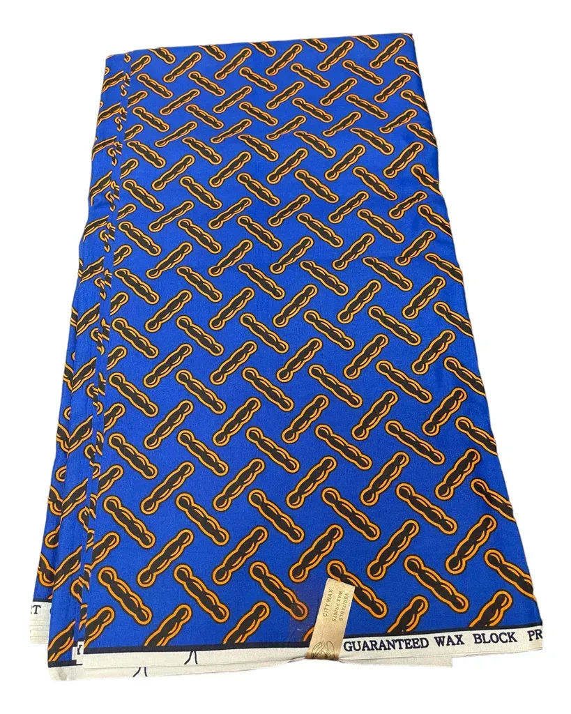 Blue patterned fabric with gold woven print, laid flat and slightly wrinkled