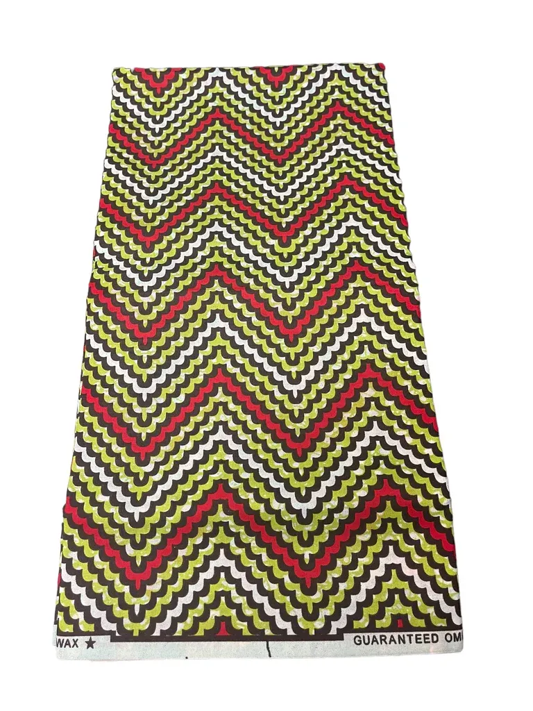 Chevron-patterned zigzag skirt in yellow, black, red, and green on a white background
