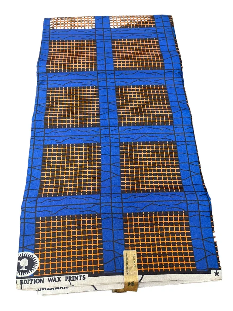 Blue and orange cargo net stretched over a wooden platform or pallet.