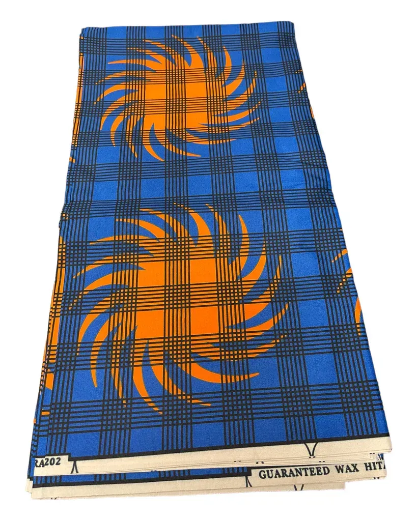 Blue and orange patterned fabric with swirling designs and plaid lines, shown flat on a white background