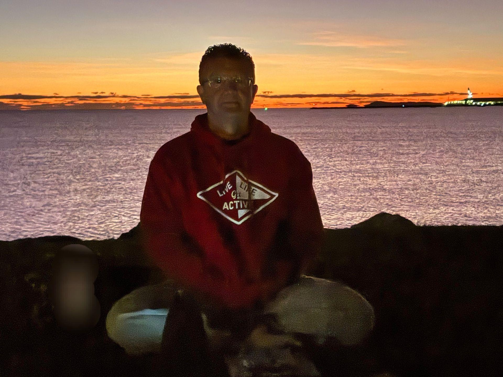 Man in Red Shirt Gestures, Leading a Yoga Class Indoors — Skilful Living in North Ward, QLD