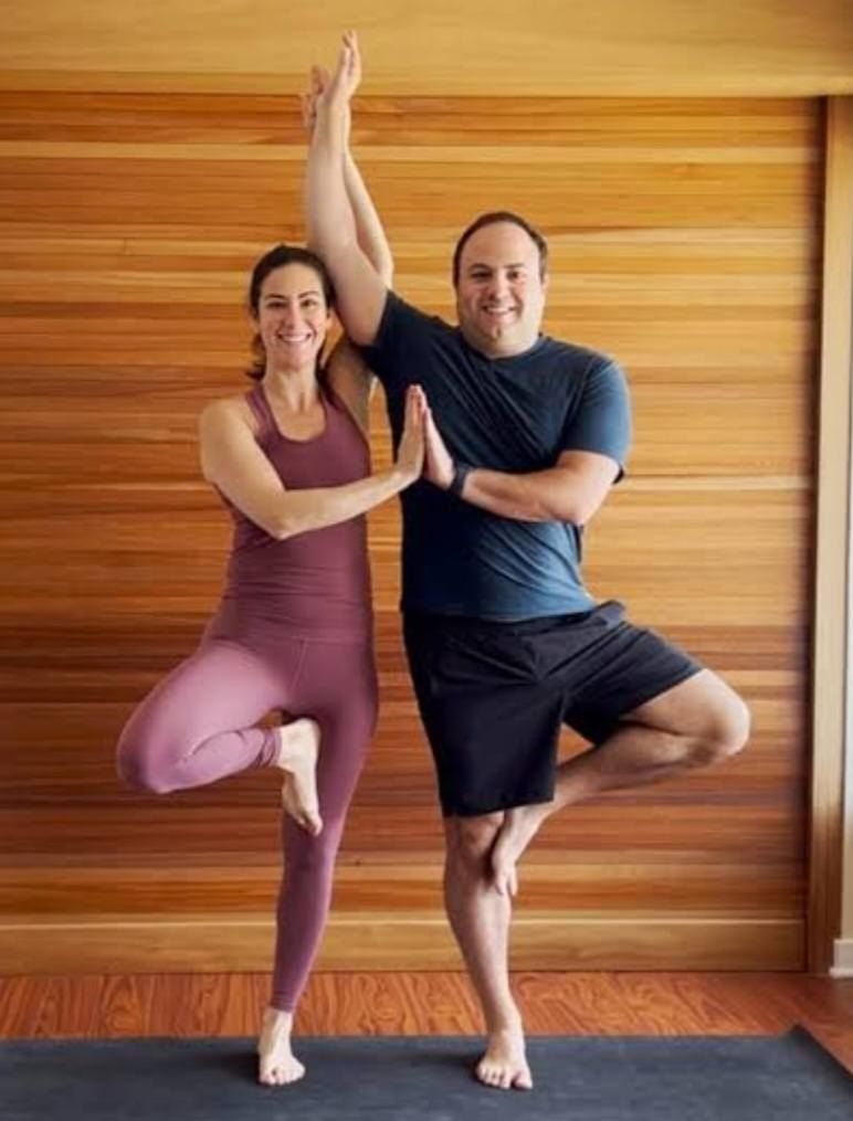 Two People in Tree Pose, Arms Raised — Skilful Living in North Ward, QLD