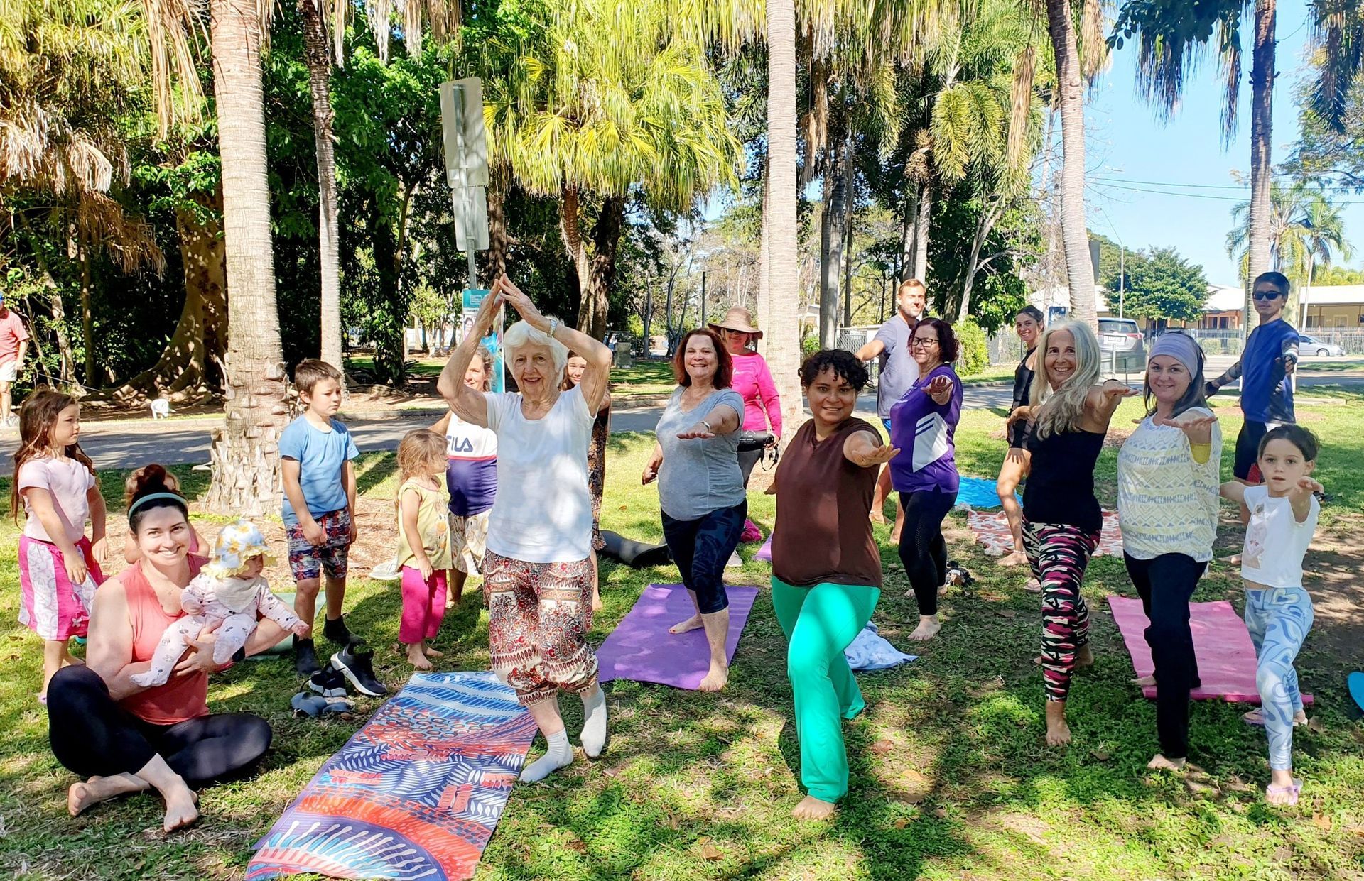 Group of People Doing Yoga Outdoors in a Park — Skilful Living in North Ward, QLD