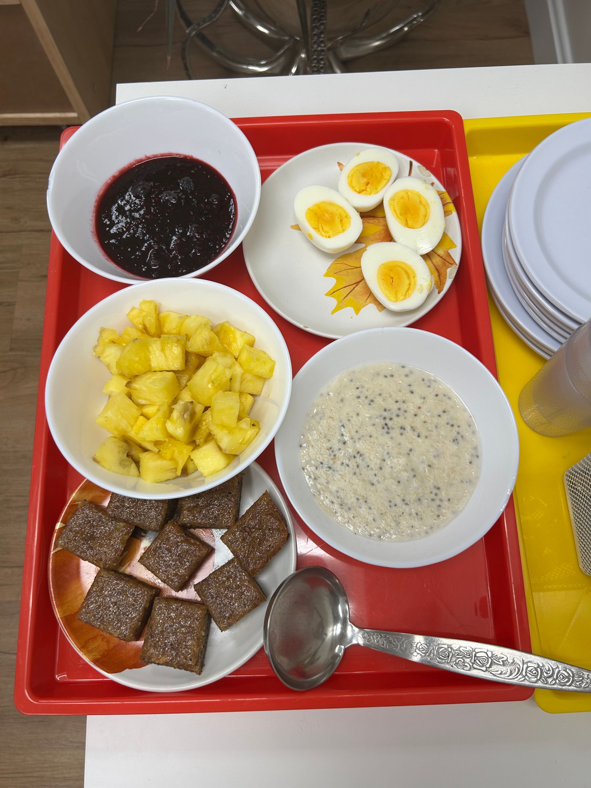 A tray of food with a spoon on it