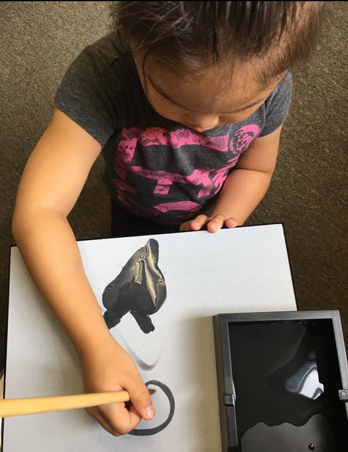 montessori child engaging with painting activity