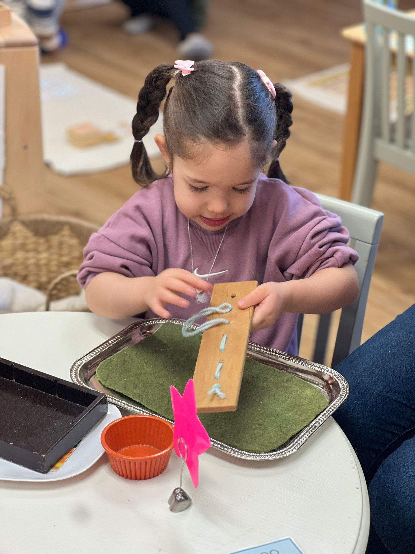 montessori toddler working in the classroom