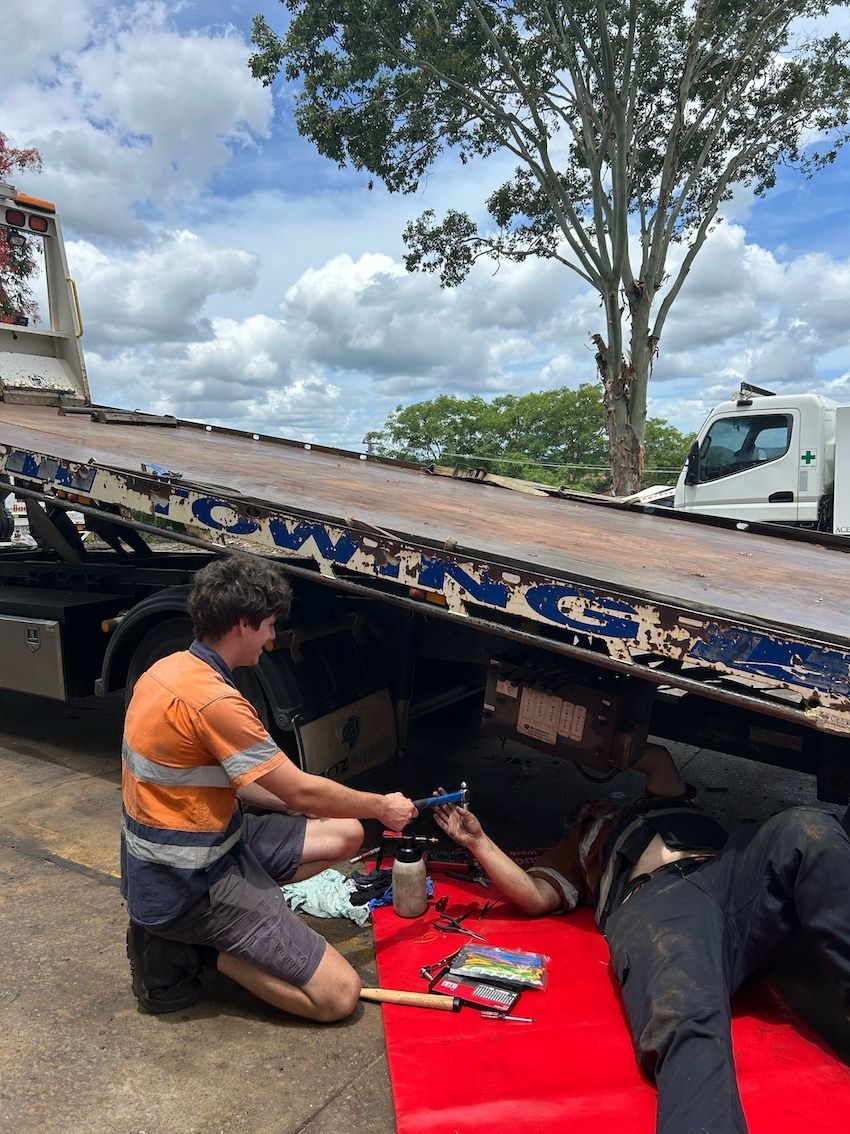 Men Re[airing Towing Truck Hydraulics — Wide Bay Hydraulics in Maryborough, QLD